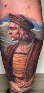 Close-up detail of a color realism tattoo with oil painting texture by Joni.