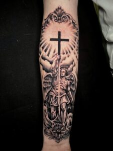 Custom black and grey forearm tattoo completed in one session by Joni.