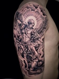St Michael Archangel defeating the demon black and grey realism tattoo by Joni.